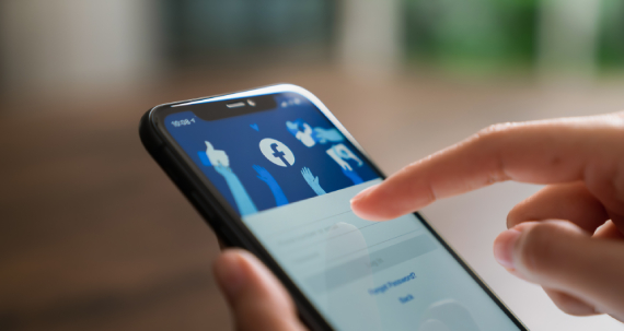 Person using facebook on phone