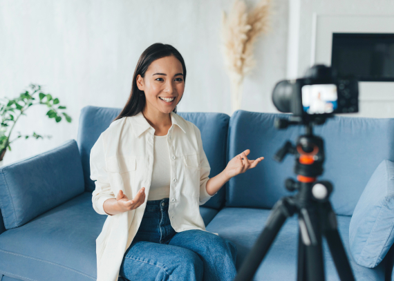 Lady on couch being video-recorded